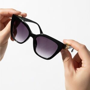 Elegant Black Sunglasses with Gold Accents